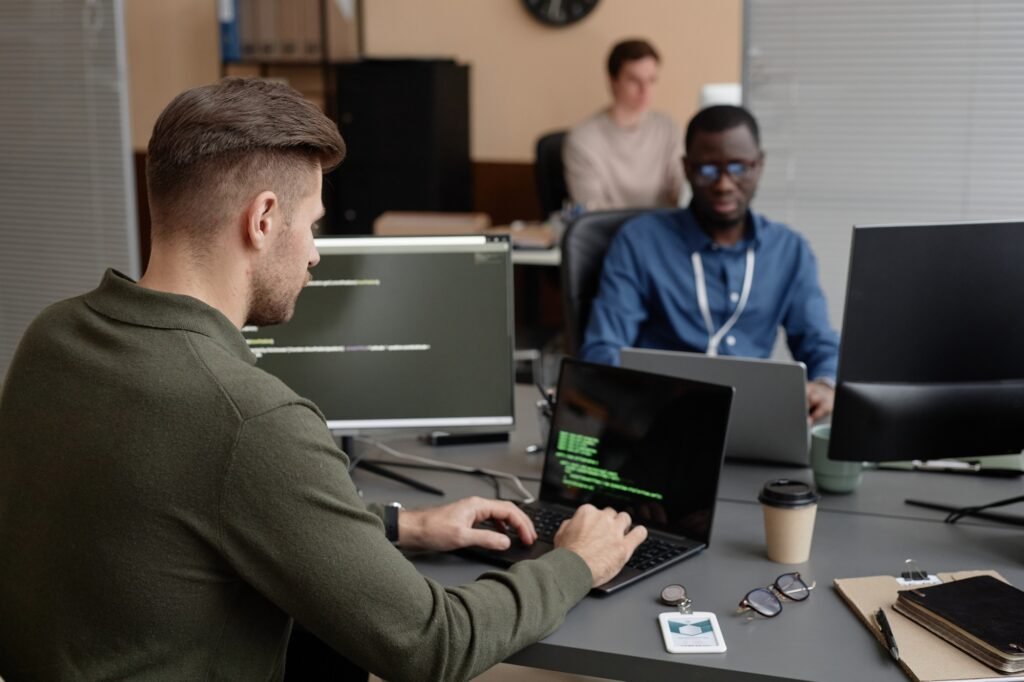 Cybersecurity Developer Working on Laptop