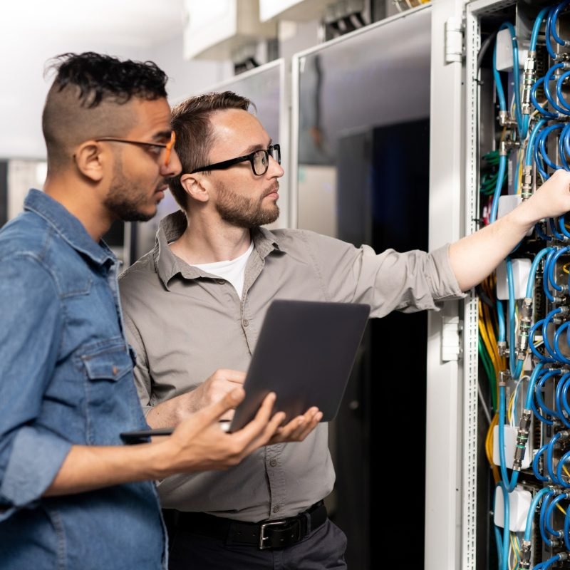 Computer support specialists analyzing network problem Computer support specialists analyzing network problem
